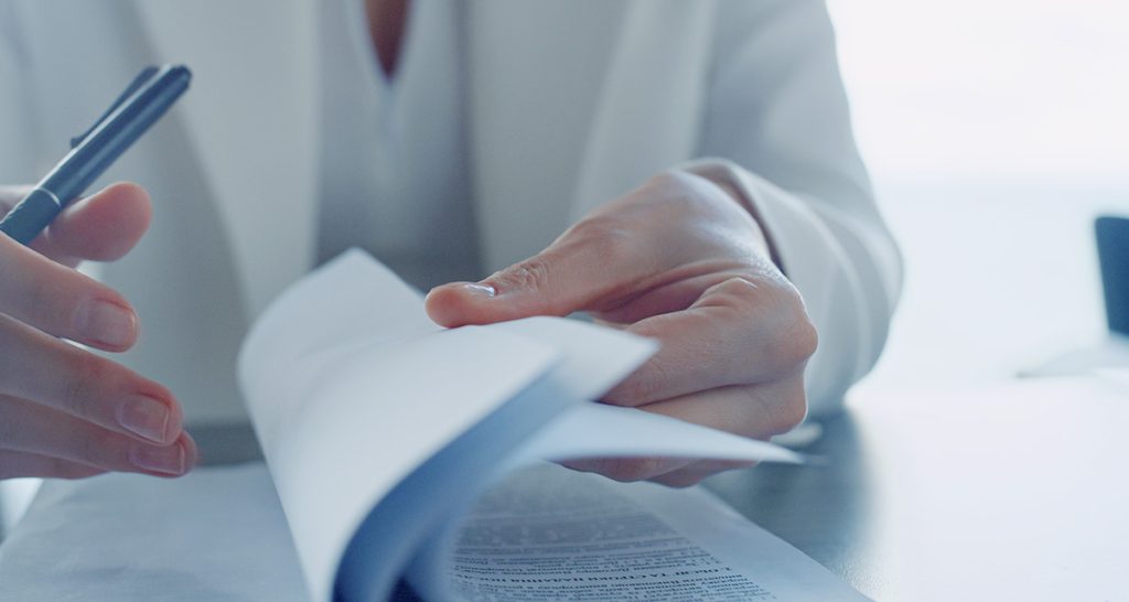 Woman reading media release from Community Mental Health Australia