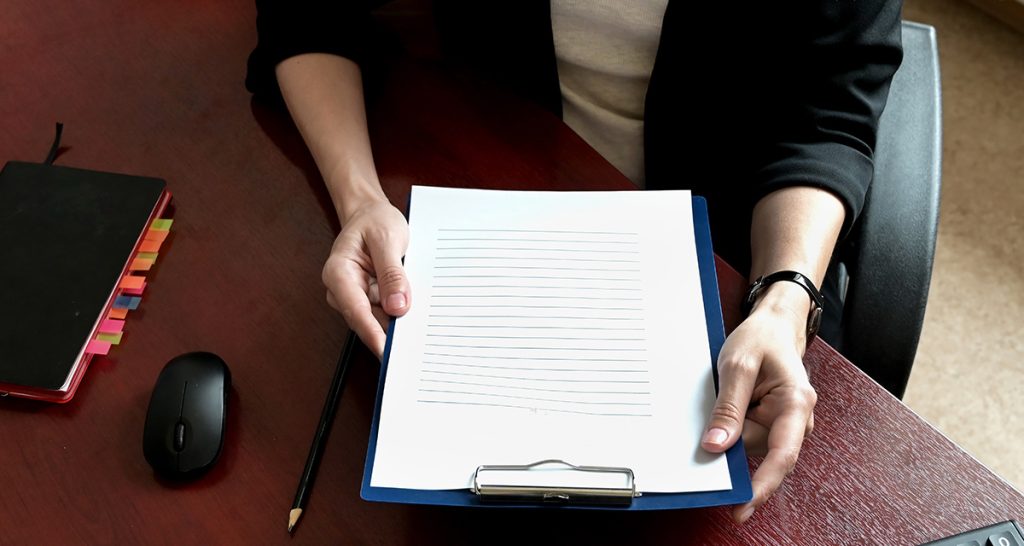 CMHA Board Member with papers