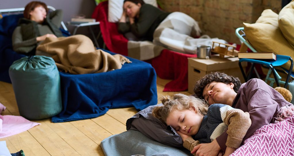 People sleeping in evacuation area