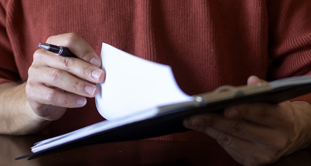 Person looking at NDIS submission from Community Mental Health Australia
